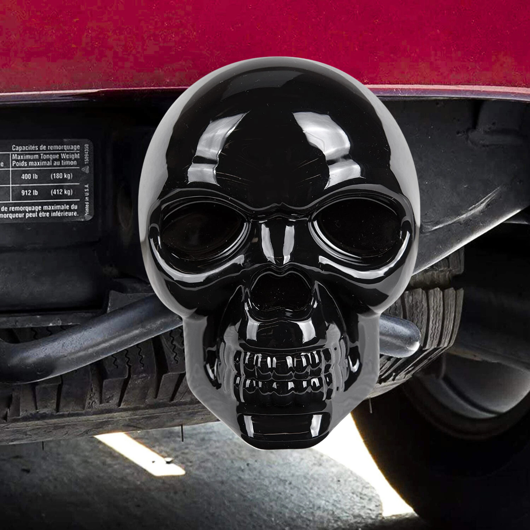 Black skull LED lighted trailer hitch cover installed on truck receiver hitch showing real vehicle fitment and aggressive custom appearance