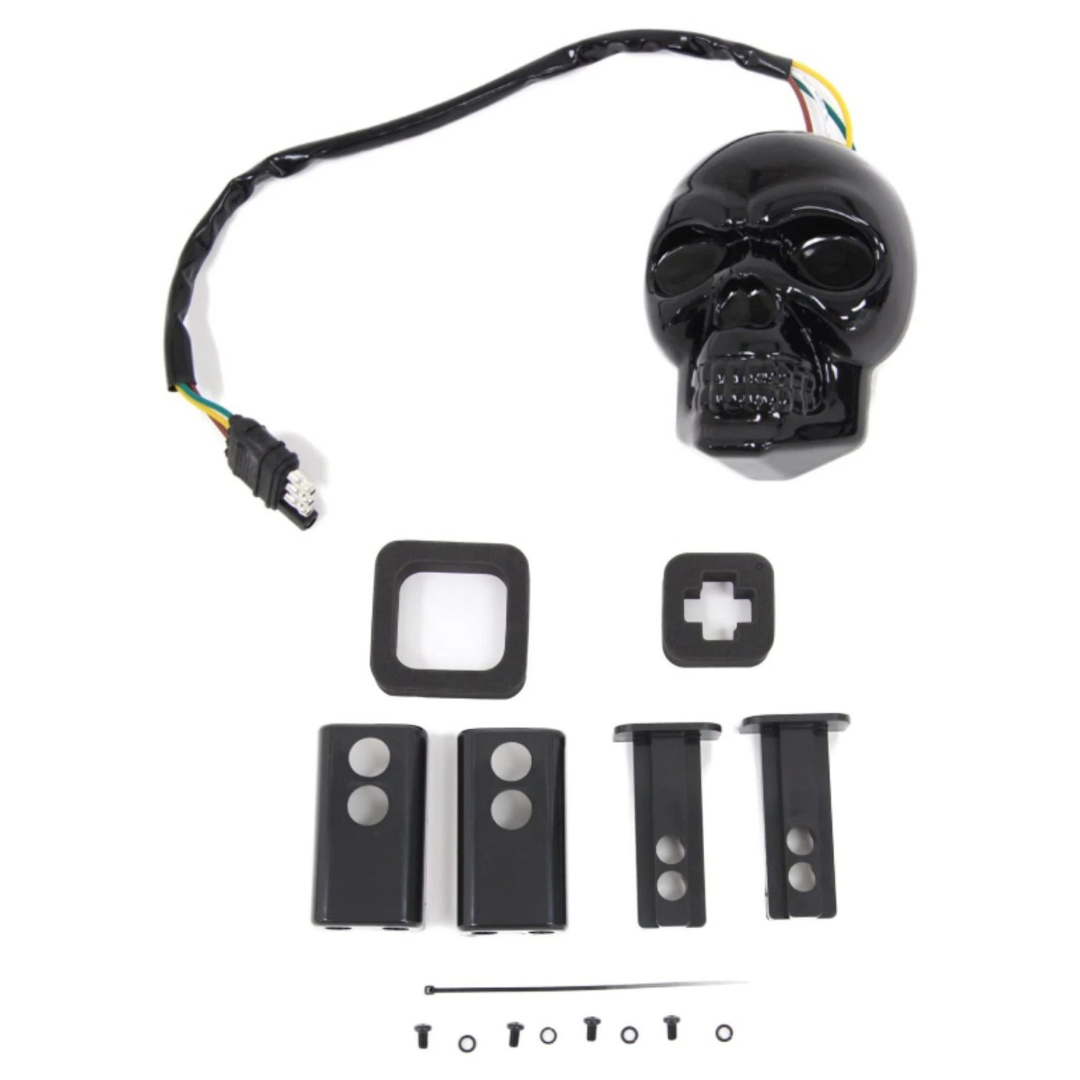 Skull LED trailer hitch cover kit contents including black skull cover, wiring harness, mounting adapters and hardware for 1-1/4 and 2 inch receivers