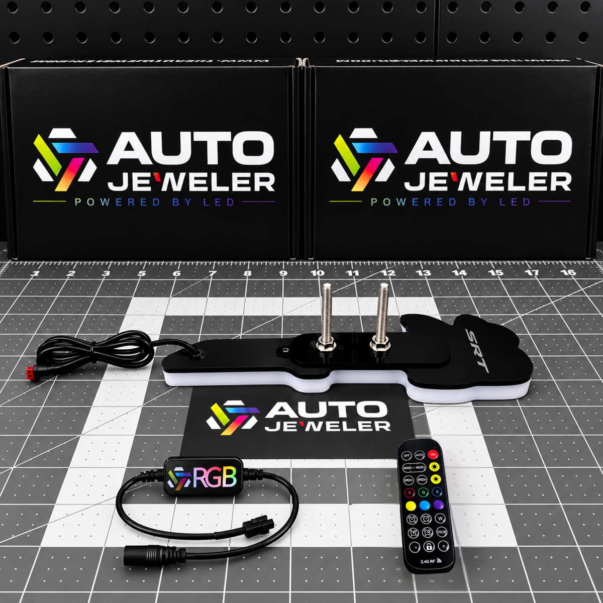 Rear view of SRT Bee Flow Series LED emblem showing mounting studs, wiring, RGB controller and remote