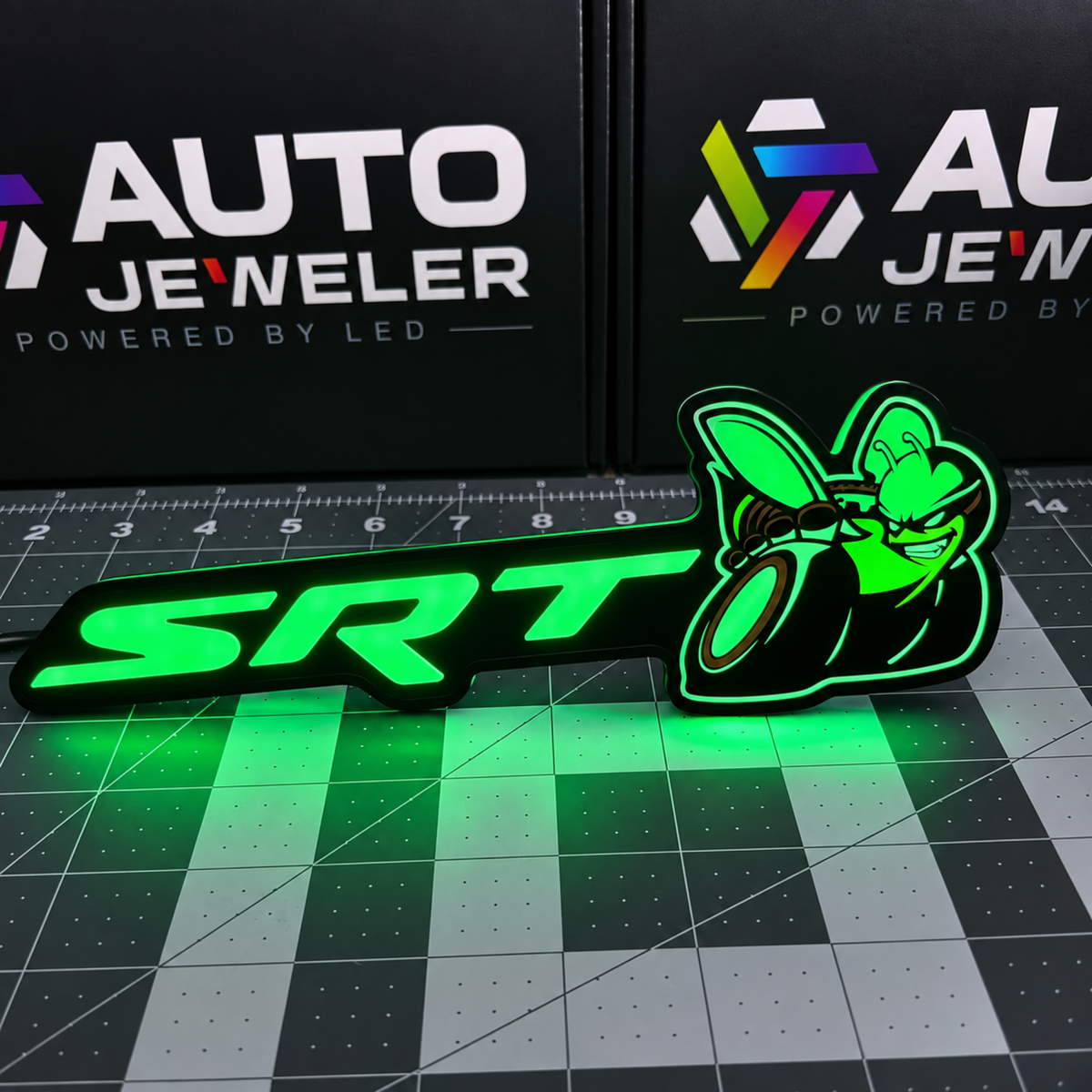 SRT Bee Flow Series RGB LED emblem illuminated bright green showing SRT lettering and bee design