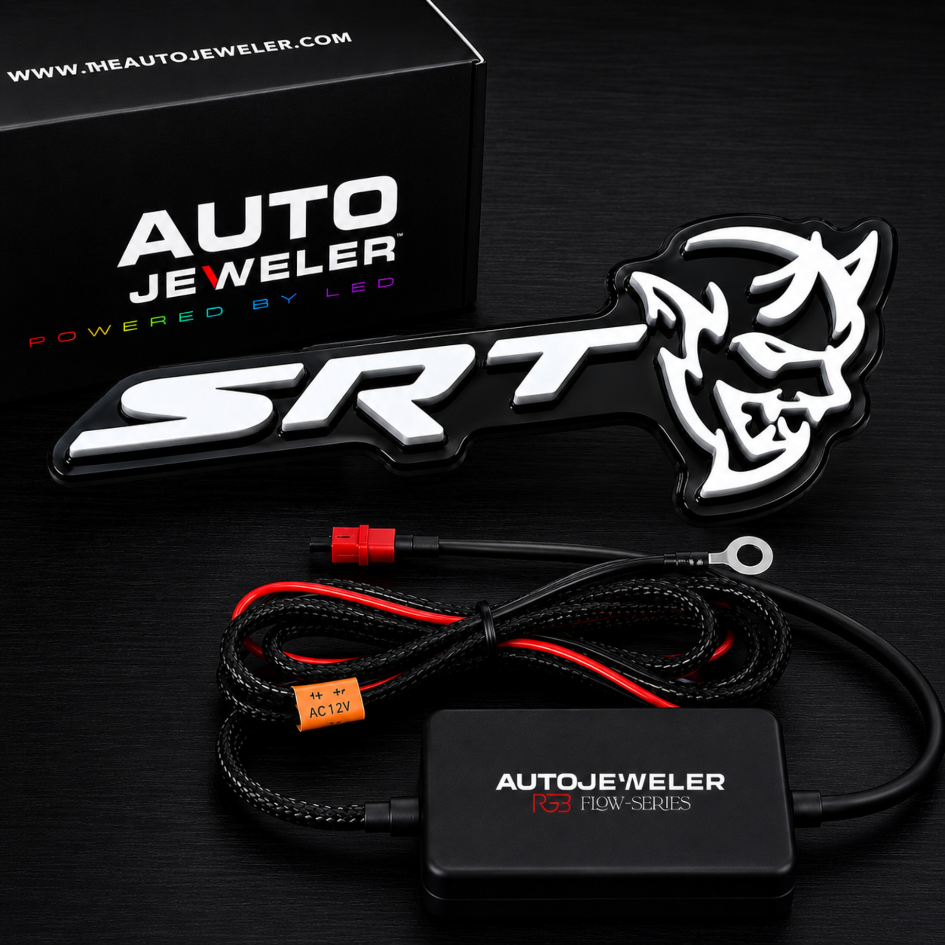 AutoJeweler SRT Demon RGB Flow Series LED emblem with controller module, wiring harness and retail packaging.