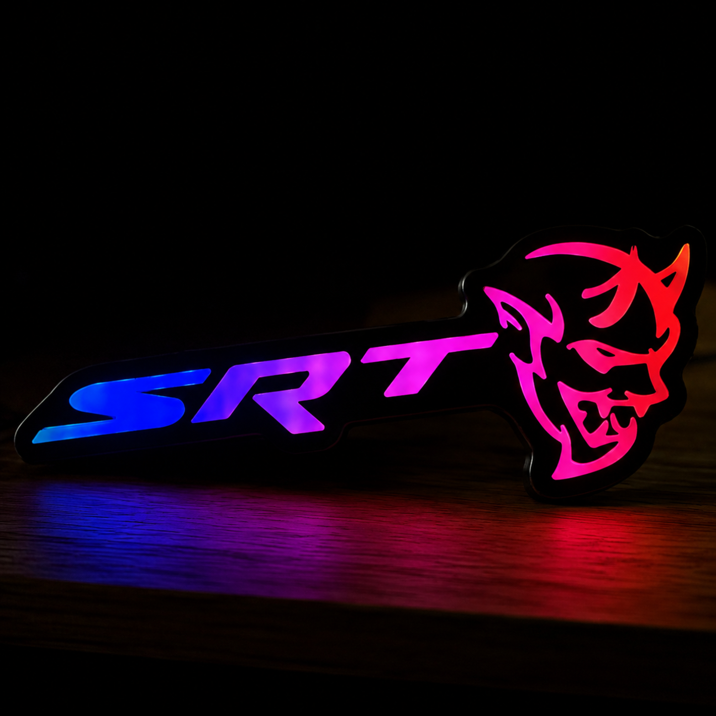 SRT Demon RGB LED emblem illuminated with purple and blue flow effect showing vibrant custom lighting modes.