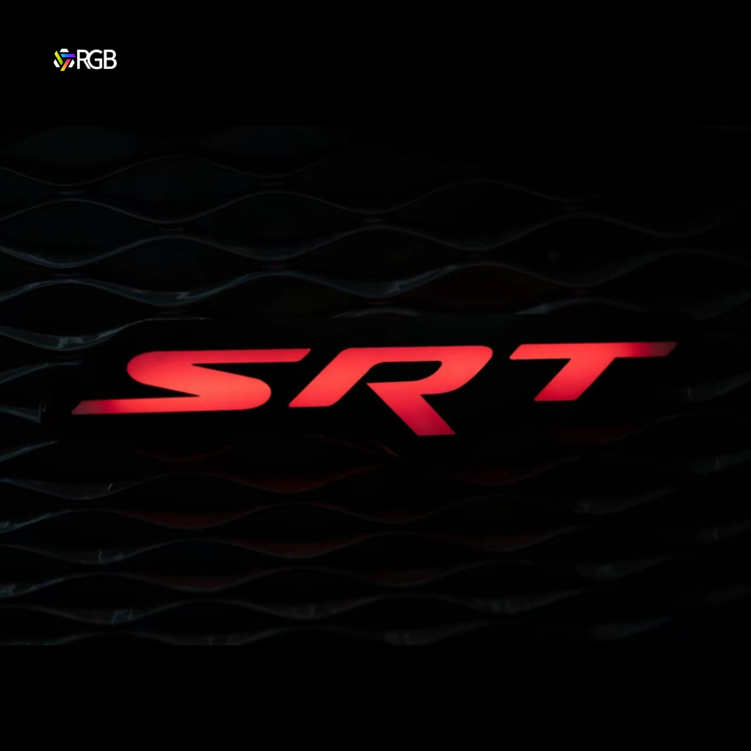 LED Dodge SRT grille emblem glowing red on front grille.