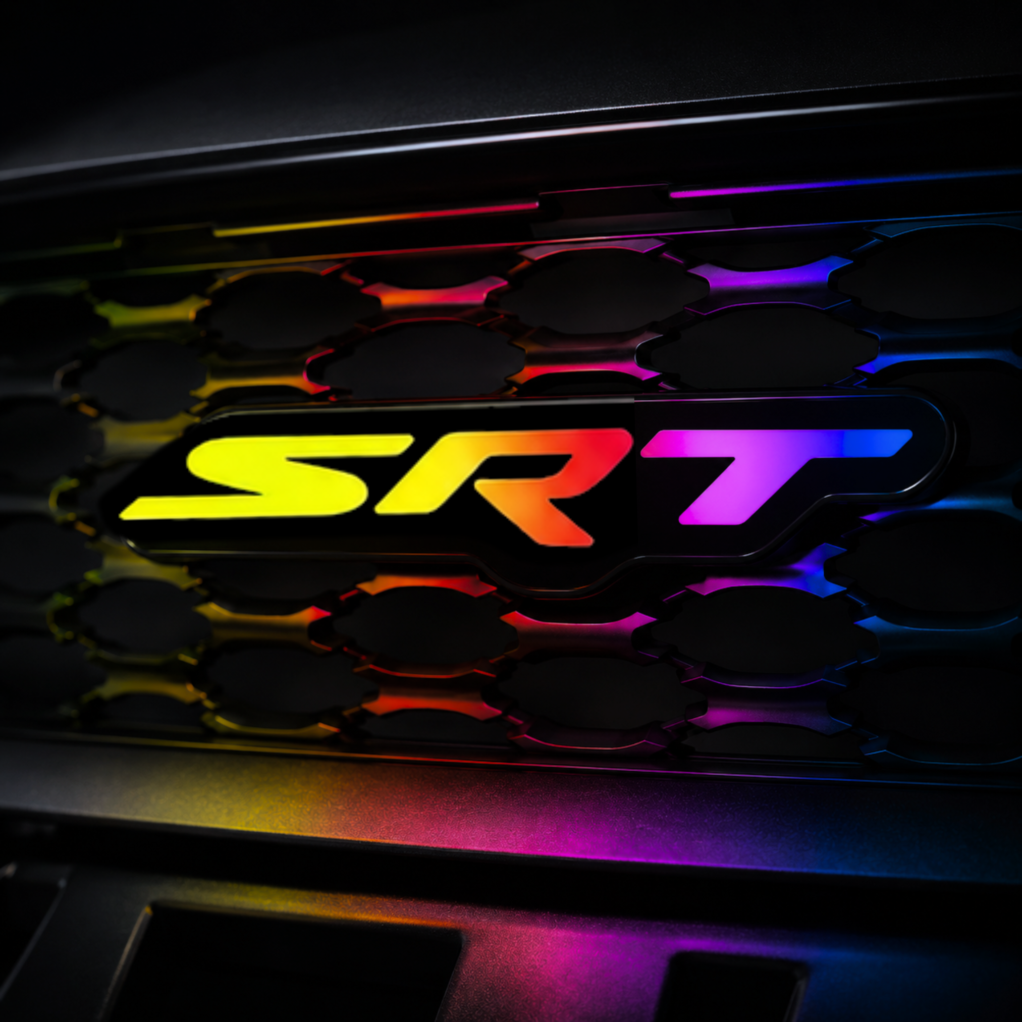 SRT RGB Flow Series LED grille emblem installed on black grille with rainbow flow lighting and realistic color reflections.