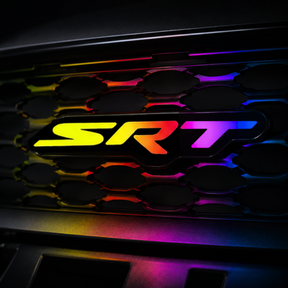 SRT RGB Flow Series LED grille emblem installed on black grille with rainbow flow lighting and realistic color reflections.