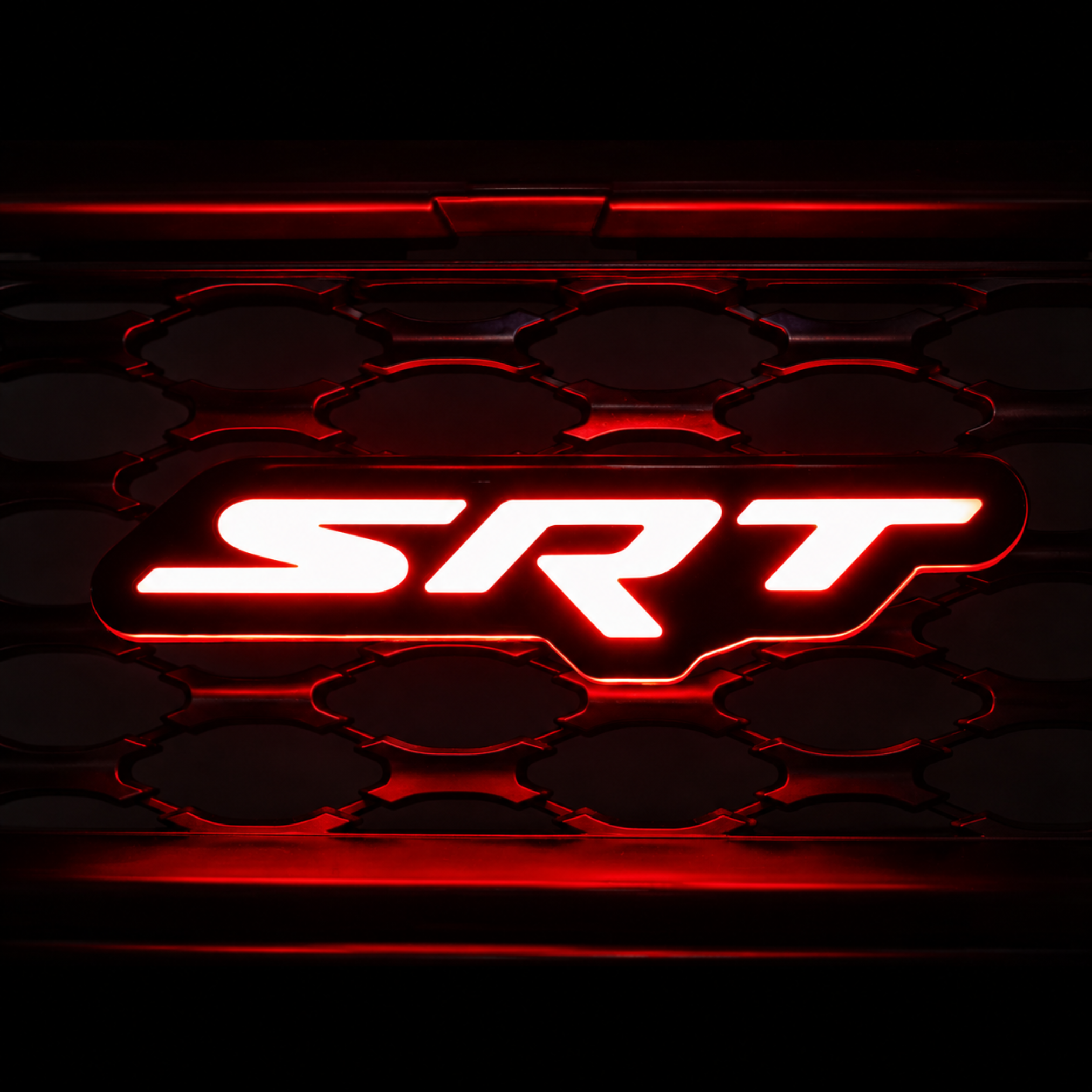 AutoJeweler RGB Flow Series SRT LED grille emblem glowing red installed in Dodge Charger grille