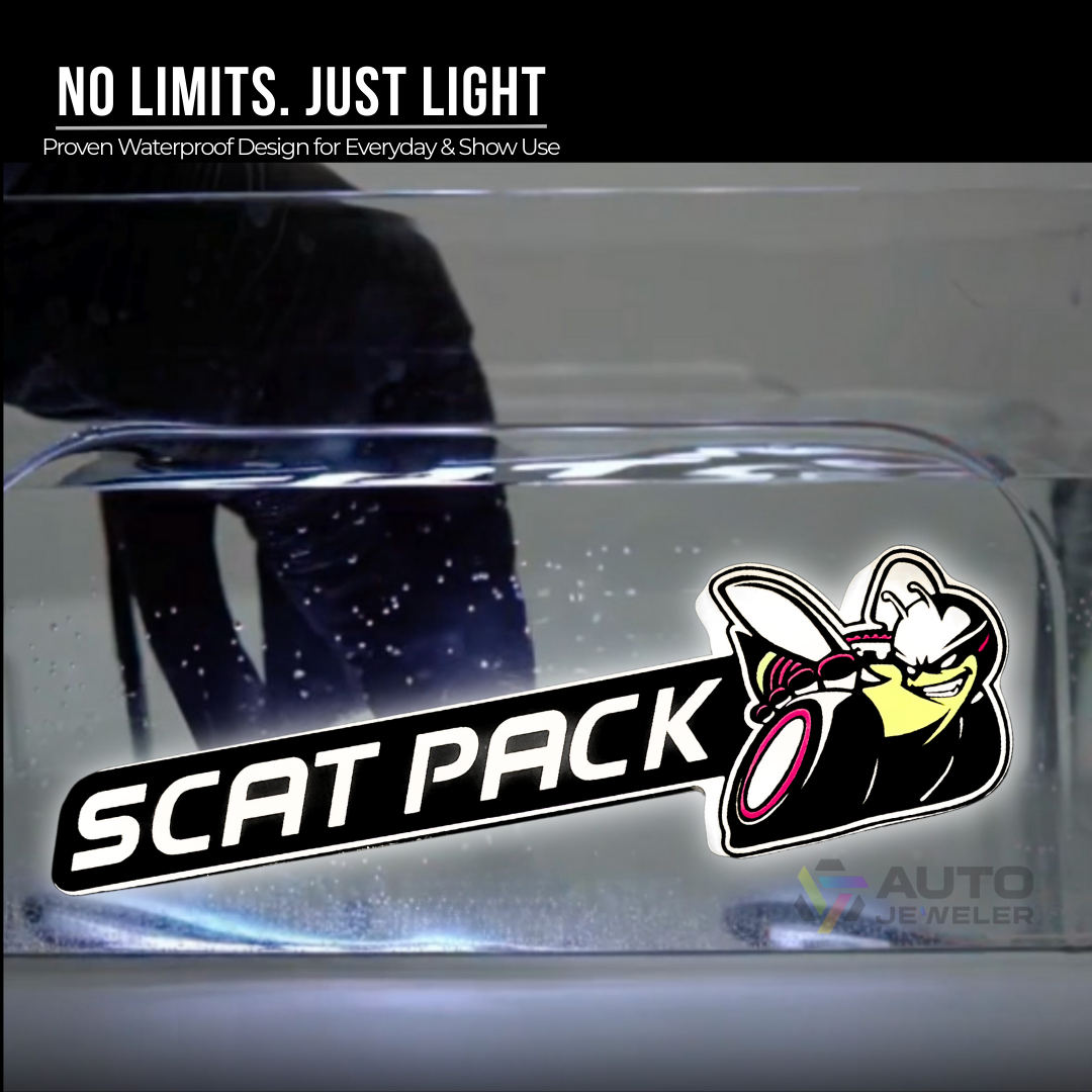 Water-resistant SRT Scat Pack LED emblem during splash test glowing bright white under water