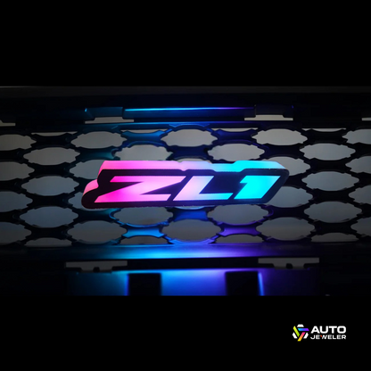 Close-up of ZL1 Flow Series RGBW LED grille emblem glowing pink and blue – universal fit custom front badge by AutoJeweler.
